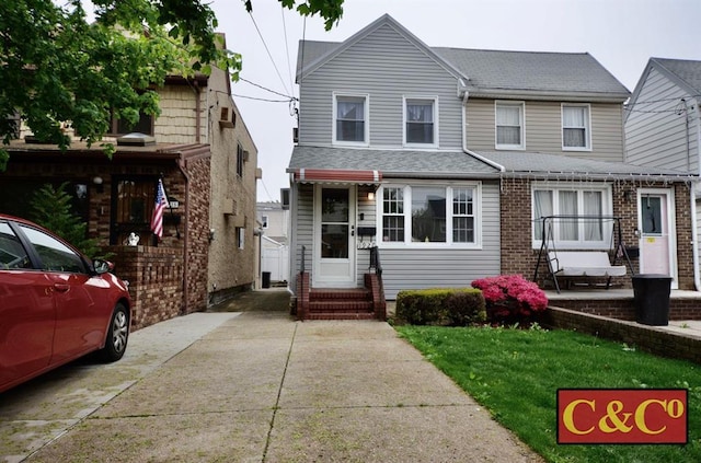 1927 E 34th St, Brooklyn, NY 11234 - view of front facade with entry steps and a shingled roof