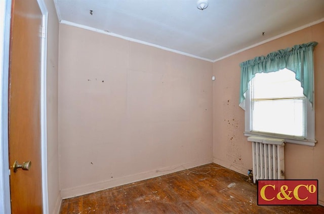 1927 E 34th St, Brooklyn, NY 11234 - spare room featuring radiator, crown molding, and hardwood / wood-style flooring