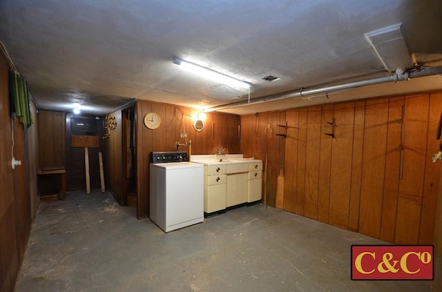 1927 E 34th St, Brooklyn, NY 11234 - finished below grade area with washer / clothes dryer, wooden walls, and a sink