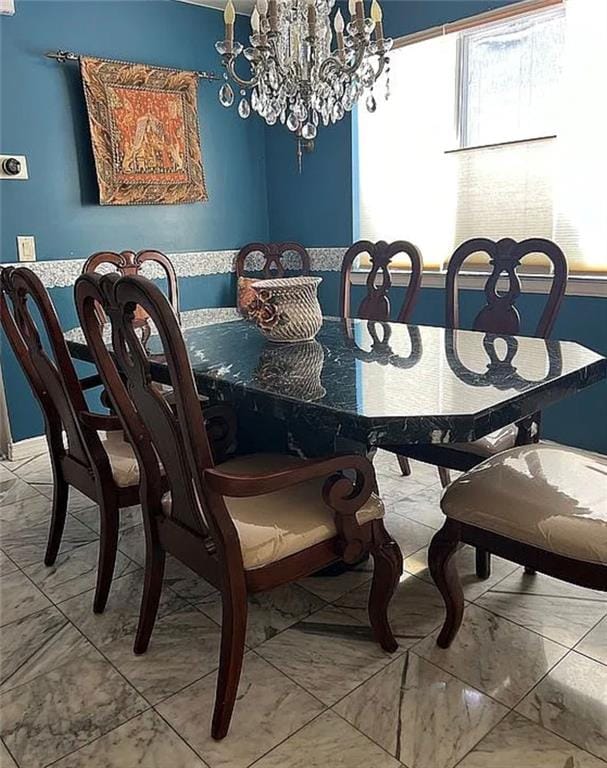 2054 Richomond Ave, New Springville, NY 10314 - dining area featuring plenty of natural light, marble look tile flooring, and a chandelier