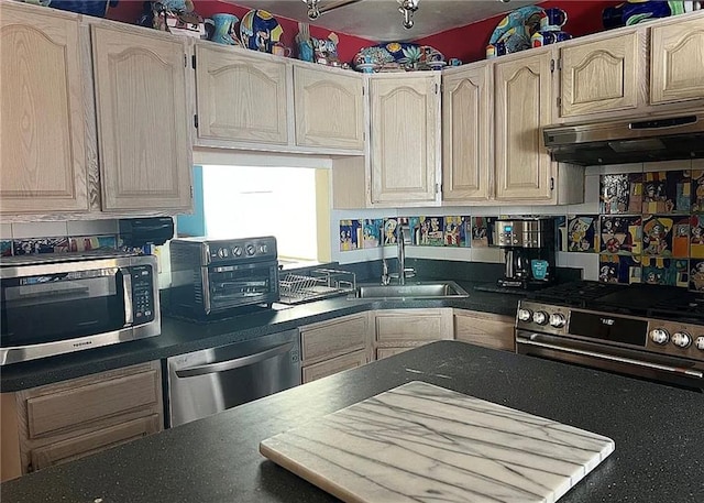 2054 Richomond Ave, New Springville, NY 10314 - kitchen featuring appliances with stainless steel finishes, ventilation hood, a sink, and dark countertops