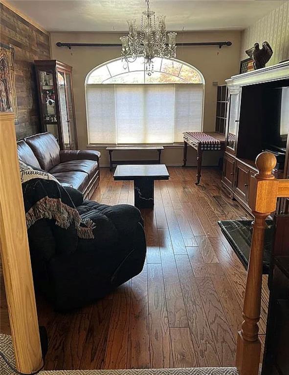 2054 Richomond Ave, New Springville, NY 10314 - living area with hardwood / wood-style flooring, plenty of natural light, and a chandelier