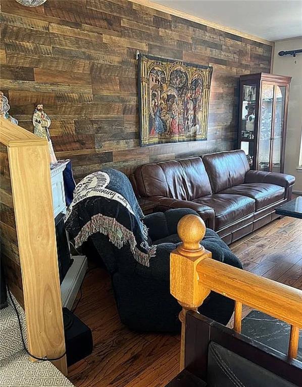 2054 Richomond Ave, New Springville, NY 10314 - living room with wood finished floors and wood walls