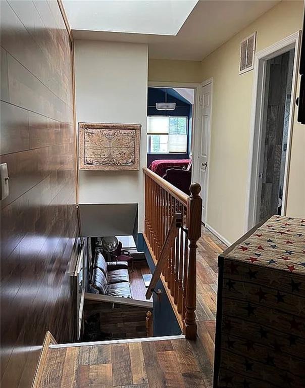 2054 Richomond Ave, New Springville, NY 10314 - stairs with hardwood / wood-style floors and baseboards