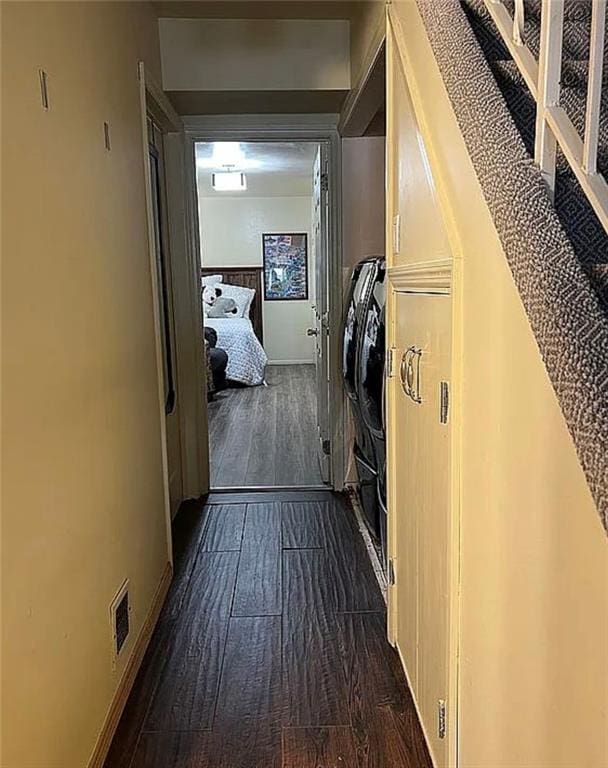 2054 Richomond Ave, New Springville, NY 10314 - laundry room featuring dark wood finished floors and baseboards