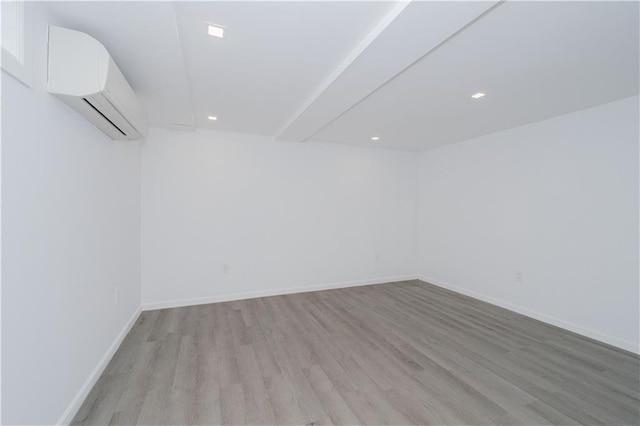 3553 Hylan Blvd, Staten Island, NY 10308 - additional living space featuring light wood-style floors, a wall unit AC, recessed lighting, and baseboards