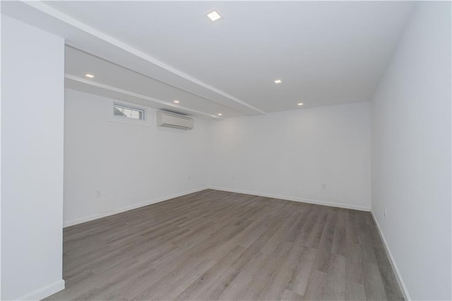 3553 Hylan Blvd, Staten Island, NY 10308 - below grade area with an AC wall unit, wood finished floors, recessed lighting, and baseboards
