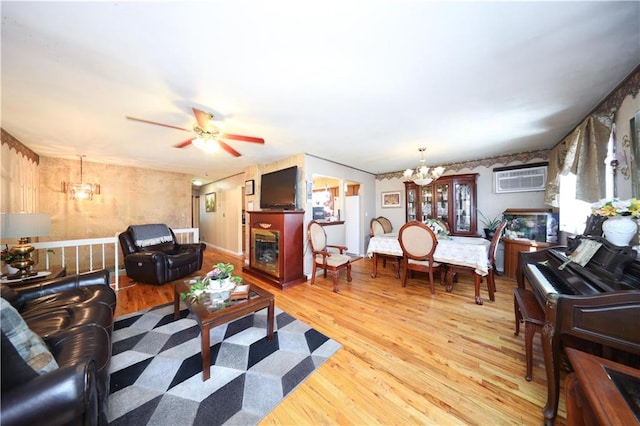 53 Marisa Cir, Staten Island, NY 10309 - living area featuring a chandelier, wood finished floors, an AC wall unit, and a ceiling fan