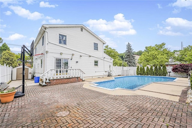 284 Todt Hill Rd, Staten Island, NY 10314 - view of swimming pool featuring a patio, a fenced backyard, and a storage shed