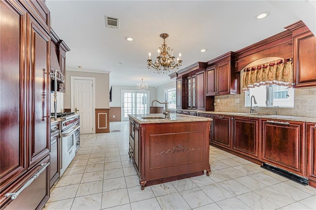 284 Todt Hill Rd, Staten Island, NY 10314 - kitchen featuring a chandelier, high end appliances, pendant lighting, decorative backsplash, and recessed lighting