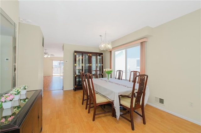 88 Jumel St, Staten Island, NY 10308 - dining area with a chandelier, light wood-style floors, and ceiling fan