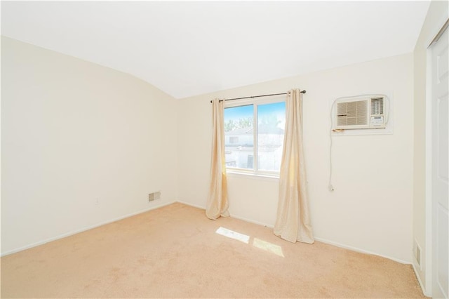 88 Jumel St, Staten Island, NY 10308 - empty room with light colored carpet, an AC wall unit, and vaulted ceiling