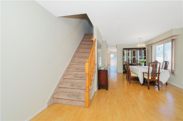 88 Jumel St, Staten Island, NY 10308 - stairs with wood finished floors and a chandelier