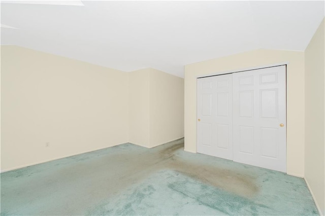 88 Jumel St, Staten Island, NY 10308 - unfurnished bedroom featuring light colored carpet, lofted ceiling, and a closet