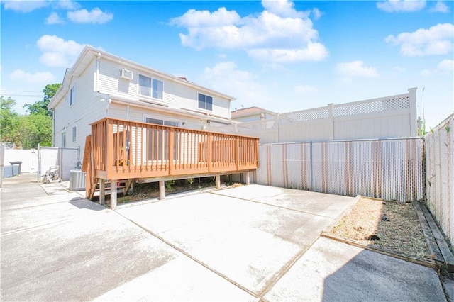 88 Jumel St, Staten Island, NY 10308 - back of house featuring a wooden deck, a fenced backyard, and a patio