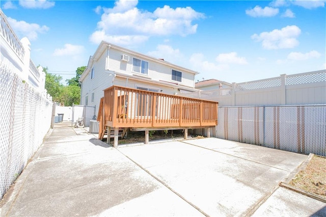 88 Jumel St, Staten Island, NY 10308 - back of property with a fenced backyard, a wooden deck, and a patio area