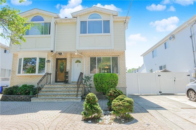 88 Jumel St, Staten Island, NY 10308 - view of front facade featuring brick siding and a gate