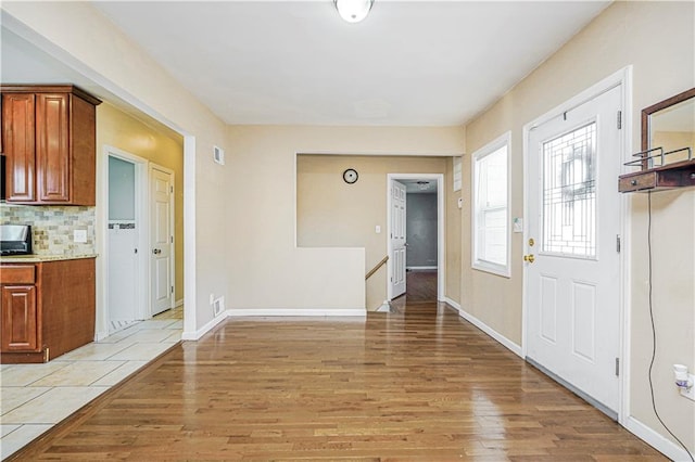 483 Van Duzer St, Staten Island, NY 10301 - foyer entrance featuring light wood-style floors and baseboards