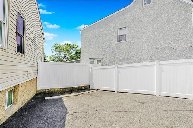 483 Van Duzer St, Staten Island, NY 10301 - view of side of property featuring a patio area and stucco siding