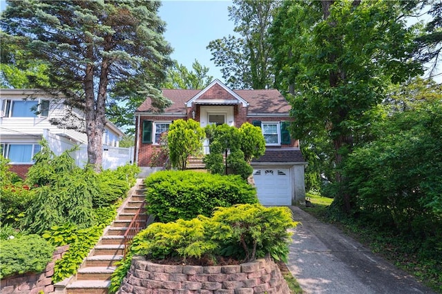 50 Glenwood Ave, Staten Island, NY 10301 - view of front facade featuring stairs, a garage, driveway, and brick siding