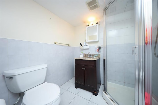 50 Glenwood Ave, Staten Island, NY 10301 - bathroom with tile walls, vanity, tile patterned flooring, and a shower stall