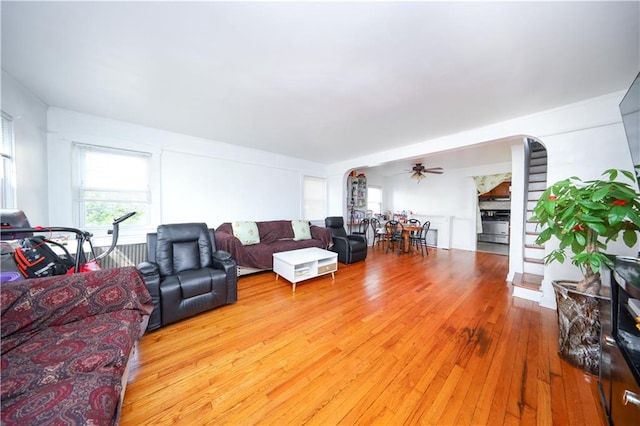 50 Glenwood Ave, Staten Island, NY 10301 - living room with arched walkways, a ceiling fan, and hardwood / wood-style flooring