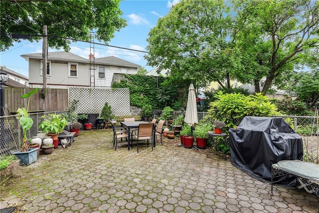 880 Bay Ridge Ave, Brooklyn, NY 11220 - fenced backyard featuring outdoor dining area, a patio, and a grill