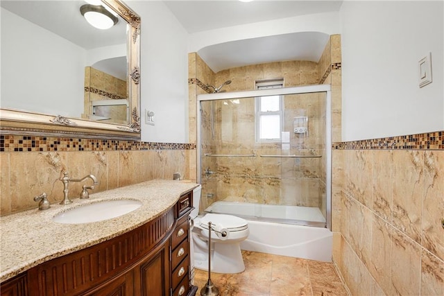880 Bay Ridge Ave, Brooklyn, NY 11220 - bathroom with tile walls, toilet, vanity, combined bath / shower with glass door, and wainscoting