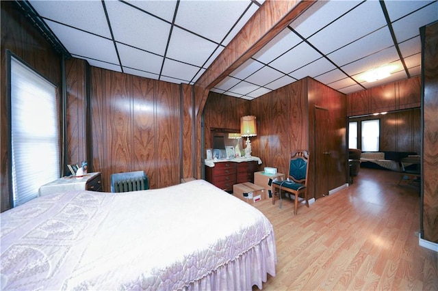 8669 15th Ave, Brooklyn, NY 11228 - bedroom with wood walls, wood finished floors, and a paneled ceiling