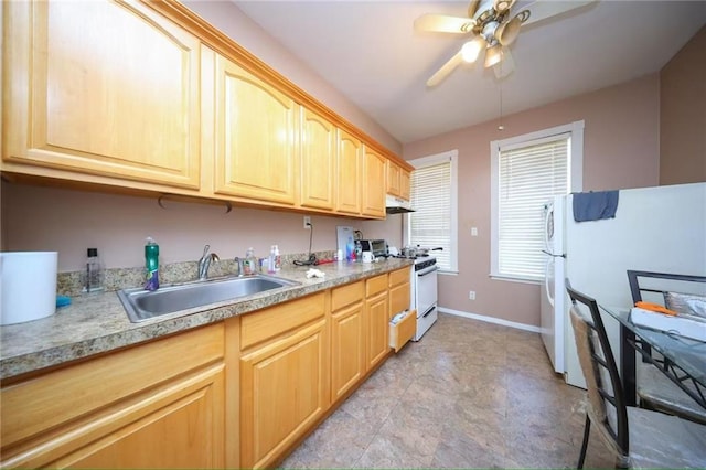 8669 15th Ave, Brooklyn, NY 11228 - kitchen featuring white appliances, light brown cabinets, ceiling fan, under cabinet range hood, and light countertops