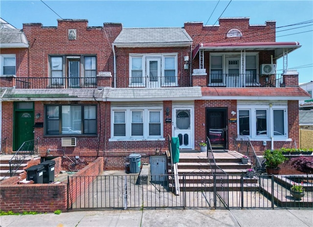 8669 15th Ave, Brooklyn, NY 11228 - view of property with a fenced front yard, brick siding, and a gate