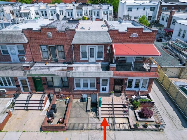 8669 15th Ave, Brooklyn, NY 11228 - view of front of house with brick siding and a residential view