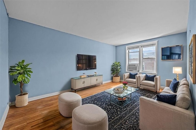 221 Mcdonald Ave Unit 6R, Brooklyn, NY 11218 - living area with wood finished floors, baseboards, and cooling unit