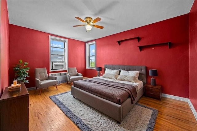 221 Mcdonald Ave Unit 6R, Brooklyn, NY 11218 - bedroom featuring radiator, wood-type flooring, baseboards, and ceiling fan