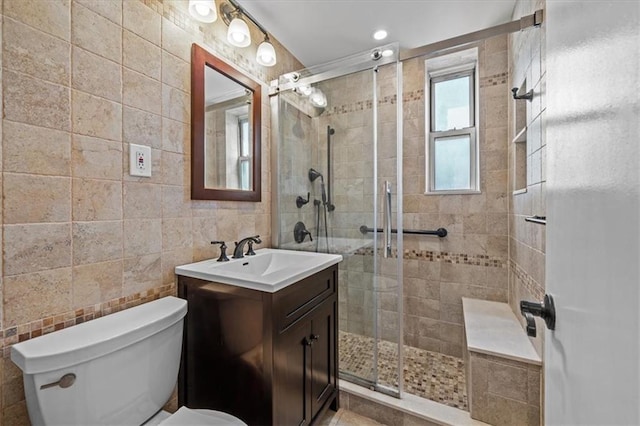 221 Mcdonald Ave Unit 6R, Brooklyn, NY 11218 - full bathroom with vanity, a stall shower, tile walls, and toilet