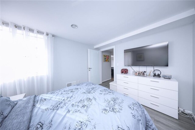 2784 E 12th St Unit 3, Brooklyn, NY 11235 - bedroom featuring multiple windows and wood finished floors