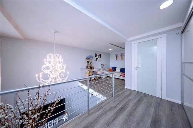 2784 E 12th St Unit 3, Brooklyn, NY 11235 - bar area featuring wood finished floors, a chandelier, baseboards, recessed lighting, and hanging light fixtures