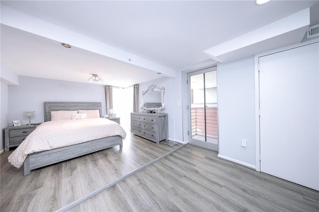 2784 E 12th St Unit 3, Brooklyn, NY 11235 - bedroom with wood finished floors, baseboards, and access to outside