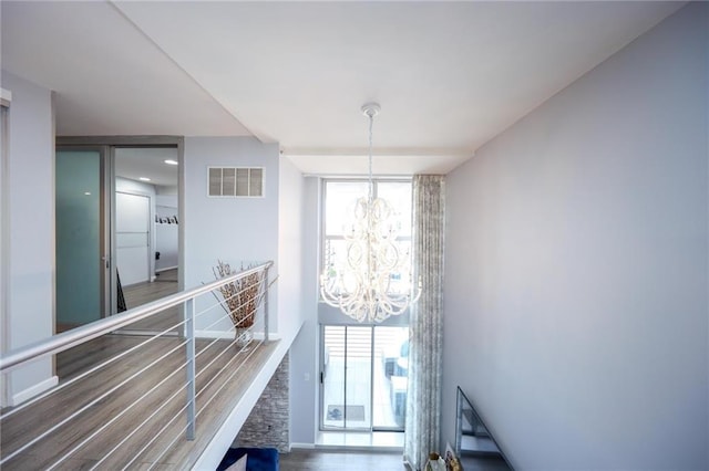 2784 E 12th St Unit 3, Brooklyn, NY 11235 - staircase with a chandelier and wood finished floors