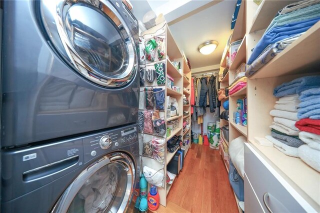 2784 E 12th St Unit 3, Brooklyn, NY 11235 - washroom with stacked washer / drying machine and wood finished floors