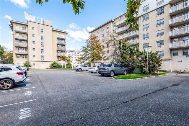 221 Bch 80th St Unit 4F, Rockaway Beach, NY 11693 - view of apartment building / complex with uncovered parking