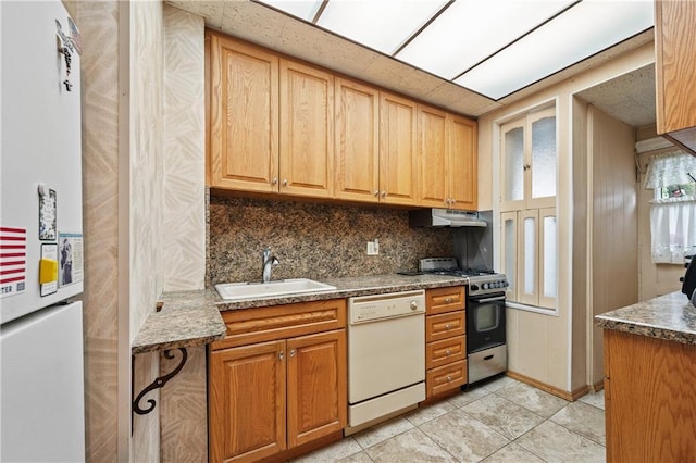 1640 W 1st St, Brooklyn, NY 11223 - kitchen featuring white appliances, a sink, backsplash, under cabinet range hood, and light tile patterned flooring