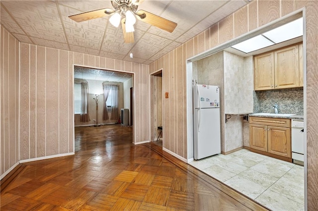 1640 W 1st St, Brooklyn, NY 11223 - kitchen featuring white appliances, a sink, baseboards, light countertops, and a ceiling fan