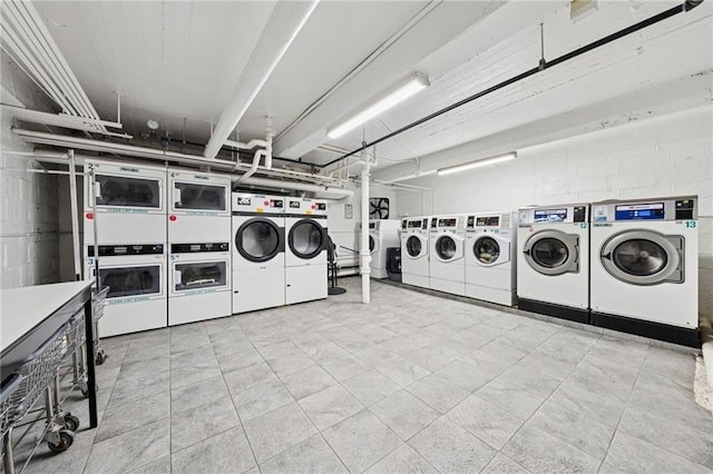 385 Argyle Rd Unit 4A, Brooklyn, NY 11218 - community laundry room with washer and dryer, stacked washing machine and dryer, and tile patterned flooring
