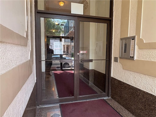 219 78th St Unit 2D, Brooklyn, NY 11209 - view of exterior entry with stucco siding