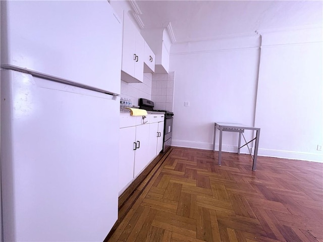 219 78th St Unit 2D, Brooklyn, NY 11209 - kitchen with freestanding refrigerator, electric range, white cabinets, backsplash, and ornamental molding