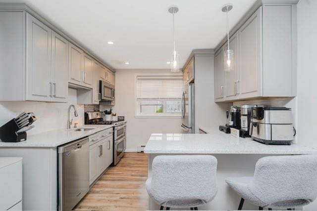 400 Maryland Ave Unit 2D, Staten Island, NY 10305 - kitchen with stainless steel appliances, a sink, light countertops, light wood finished floors, and recessed lighting