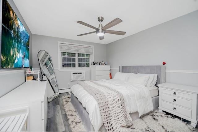 400 Maryland Ave Unit 2D, Staten Island, NY 10305 - bedroom featuring wood finished floors, a wall mounted AC, and a ceiling fan
