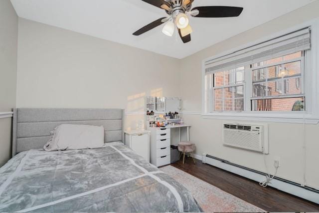 400 Maryland Ave Unit 2D, Staten Island, NY 10305 - bedroom featuring baseboard heating, wood finished floors, baseboards, ceiling fan, and an AC wall unit