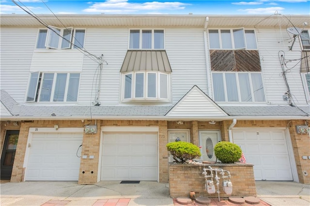 23 Peggy Ln, Staten Island, NY 10306 - multi unit property featuring an attached garage, brick siding, and driveway